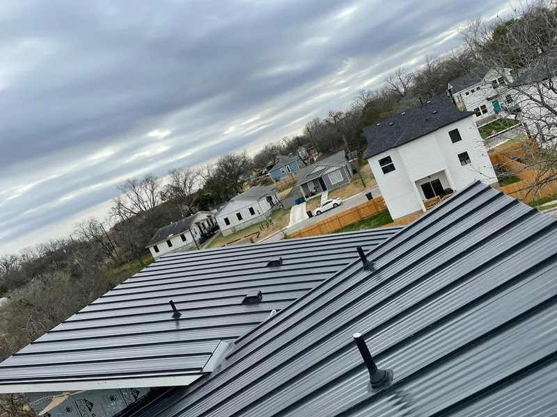 Standing seam metal roof panels with vents for Skylight Repair in West Greenwich